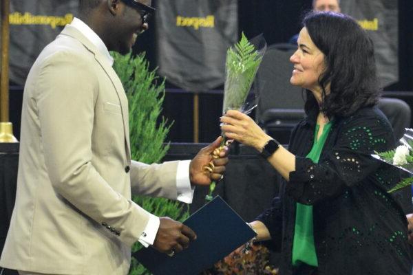 people holding a plant